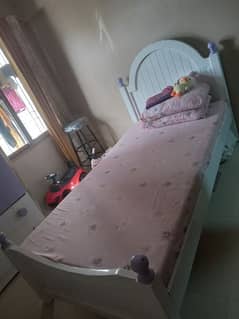 single bed with cupboard n side table