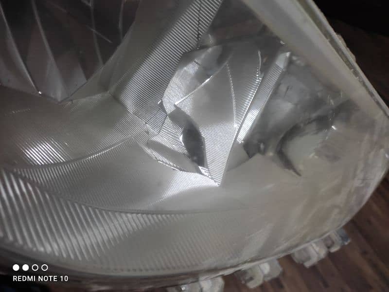 Toyota Yaris headlight R/S genuine 2