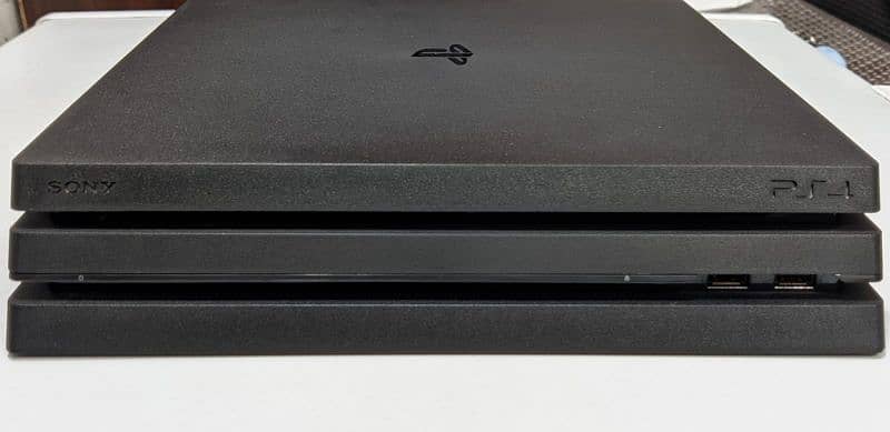ps4 pro in excellent condition with 2 controllers and 3 games cds 4
