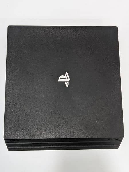 ps4 pro in excellent condition with 2 controllers and 3 games cds 5