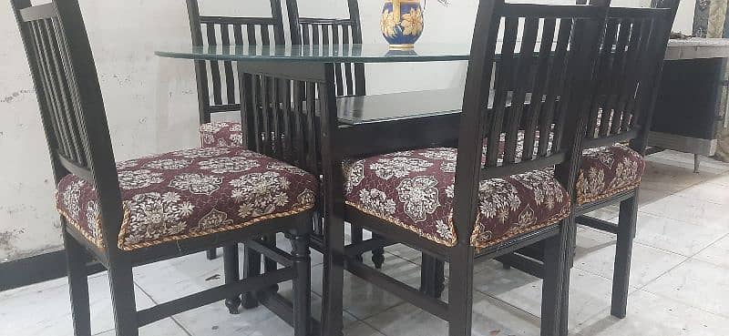 6chairs wooden dinning in excellent condition all ok with  12mmglass 4