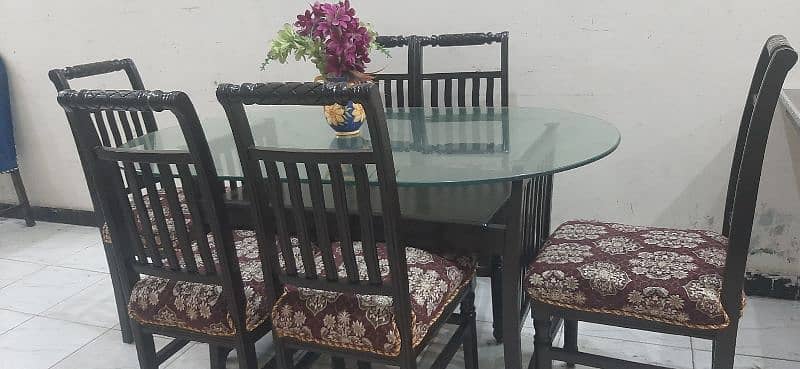 6chairs wooden dinning in excellent condition all ok with  12mmglass 6
