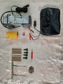Two types of car tyres tools kits,one air compressor and puncture kit.