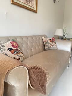7 seater sofa with pillows and throw
