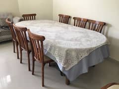 wooden dinning table with 8 chairs