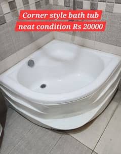 Corner style bath tub with step and sitting