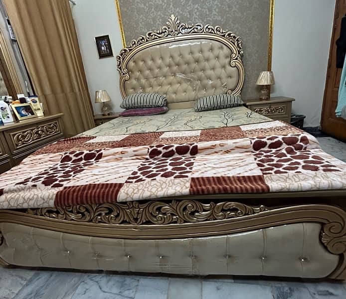 King Size cushioning Bed with 2 side tables and dresser. 0