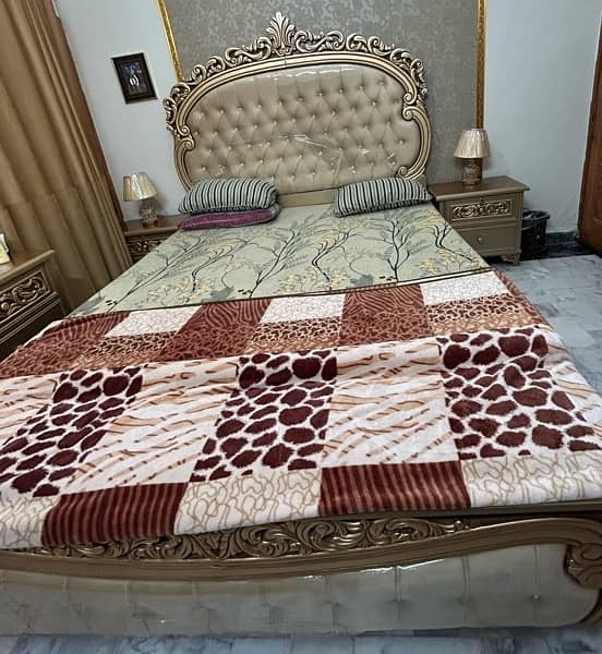 King Size cushioning Bed with 2 side tables and dresser. 1
