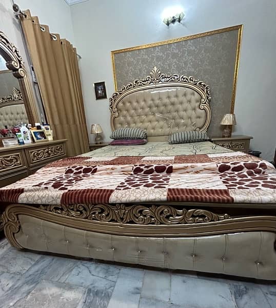 King Size cushioning Bed with 2 side tables and dresser. 2