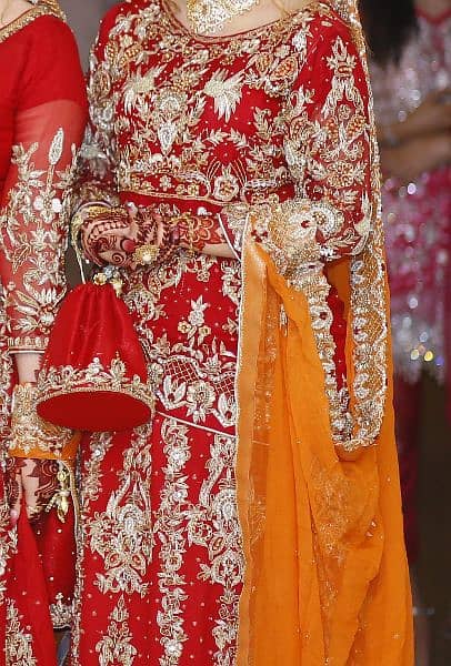Red and golden colours bridal lahnga for sale 0