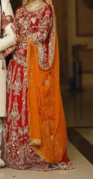 Red and goldn colors bridal lahnga very low price itny mn koi ni dy ga 7