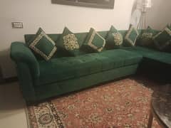 emerald green sofa with black Ayat up Kursi frame