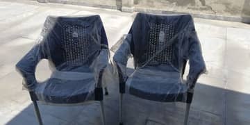 Two plastic chairs and one Table for sale