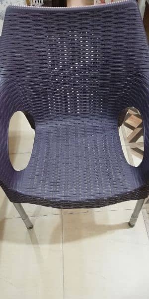 Two plastic chairs and one Table for sale 1