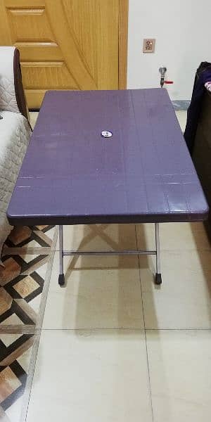 Two plastic chairs and one Table for sale 3