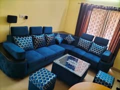 Blue sofa L shaped with table what's up numbr O3234215O57