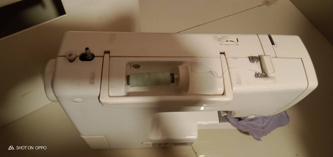 A unique style Japanese brand sewing machine. 4