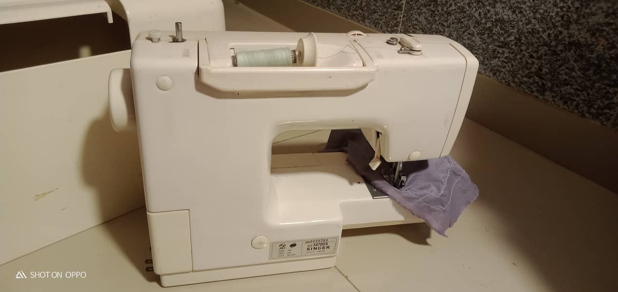 A unique style Japanese brand sewing machine. 5
