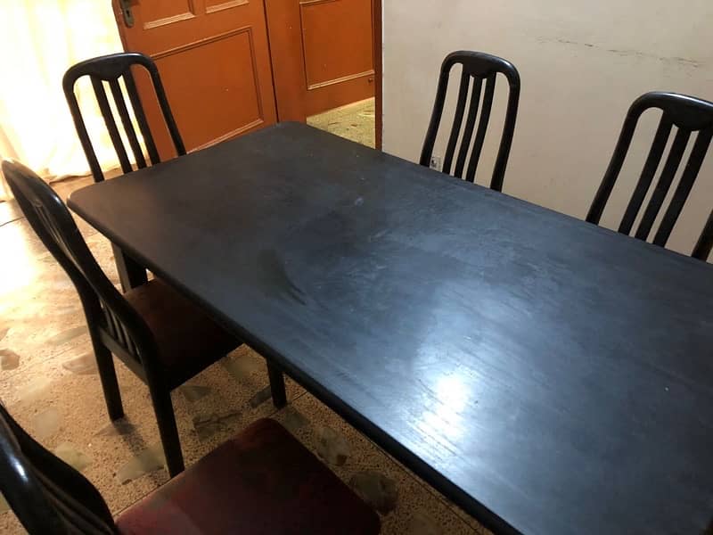 Wooden dining table with 6 chairs. 0
