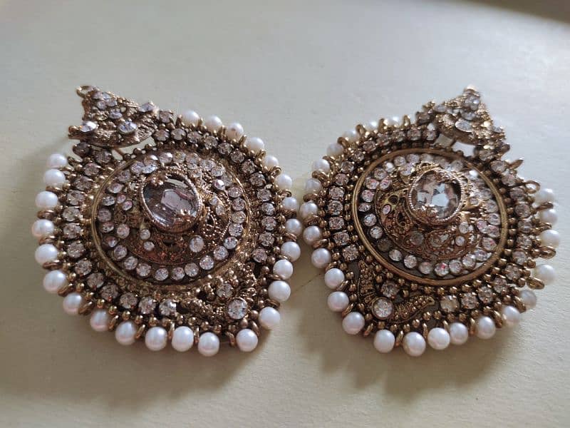 traditional kundan earnings  copper and whiye colors 0