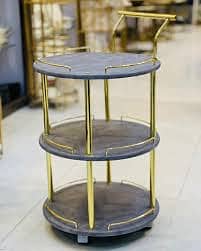 Tea trolley wooden with stainless steel golden color rods