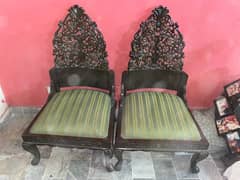 Two beautiful wooden chairs with table