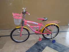 Girlish pink BMX type bicycle