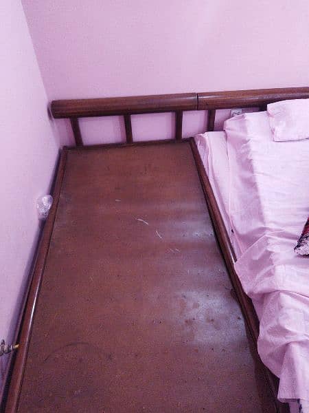 wooden single bed (used) 0