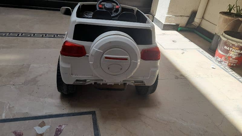 charging car for kids with remote all condition is good color is white 0