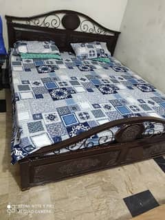 wooden bed with almirah