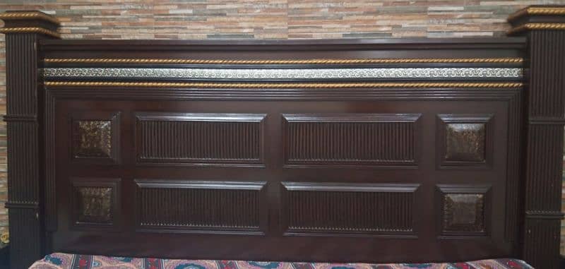 wooden bed with corner tables available in good condition. 0