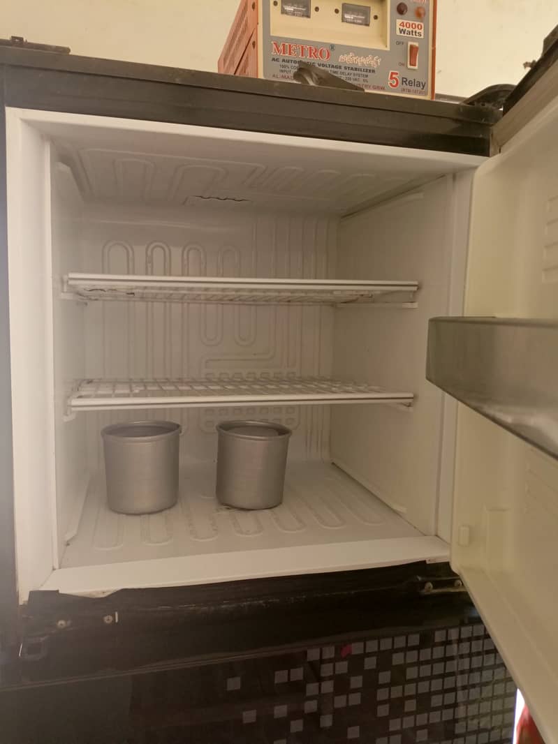 A medium size refrigerator. 2