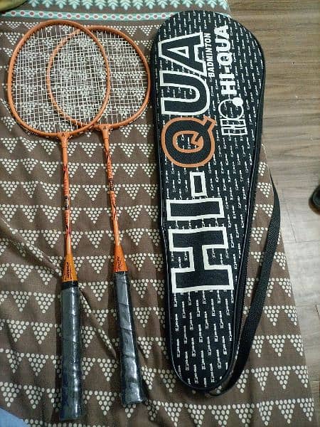 2 badminton rackets and 1 bag 0