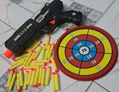 Toy shooting kids gun with colorful board