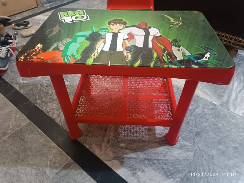 slightly used kids table with chair. 1