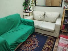 very comfortable  sofa . . with off white rakseen cover. . American style.