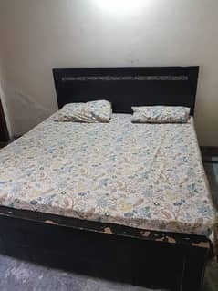 bed with matress for sale.