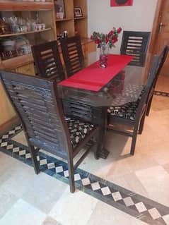 wooden Dinning Table with Glass top. 0