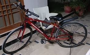 sport cycle for sale with helmet and bottle