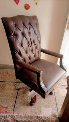 Leather covered ,movable wheeled office chair