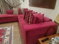 L shaped sofa with 10 cushions.