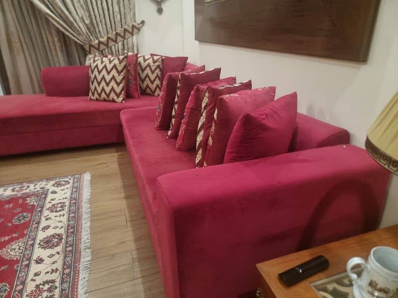 L shaped sofa with 10 cushions. 0