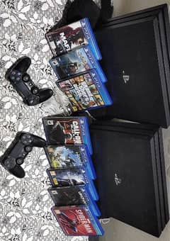 Two  PS4 pro 1 Tb buy one get one free , 2 controllers and 8 games CDs