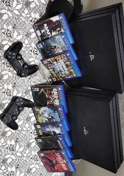 Two  PS4 pro 1 Tb buy one get one free , 2 controllers and 8 games CDs 0
