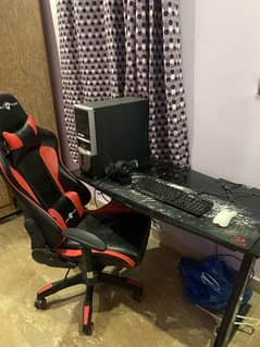 Gaming pc with chair and table.