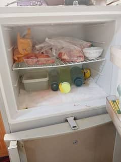 Dawlance refrigerator look like new. sealed machine