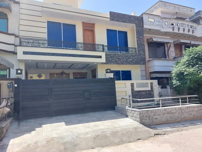 G13 Islamabad 30x60 house South open tile flooring very ideal location on 50 feet road

 Double storey double unit 

5 bed 

6 bath 

2 TV launch 

2 kitchen 

2 Drawing Rooms 

2 cars parking 

boring available

 gas available

 electricity available 1