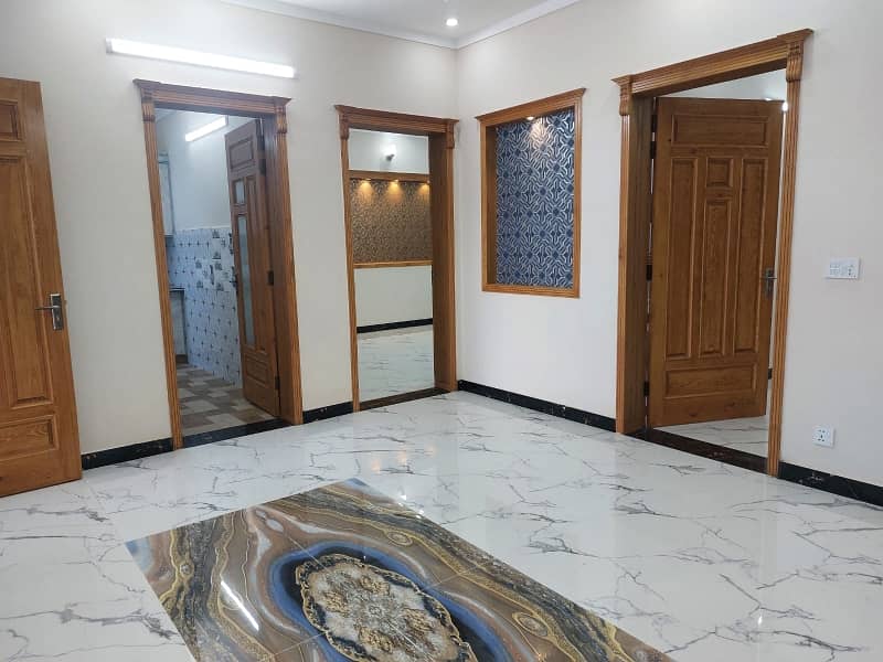G13 Islamabad 30x60 house South open tile flooring very ideal location on 50 feet road

 Double storey double unit 

5 bed 

6 bath 

2 TV launch 

2 kitchen 

2 Drawing Rooms 

2 cars parking 

boring available

 gas available

 electricity available 7