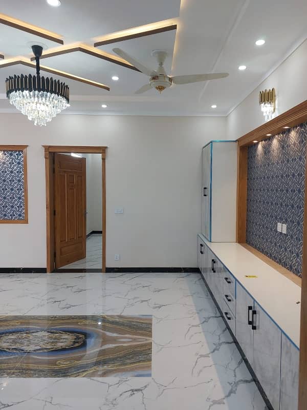 G13 Islamabad 30x60 house South open tile flooring very ideal location on 50 feet road

 Double storey double unit 

5 bed 

6 bath 

2 TV launch 

2 kitchen 

2 Drawing Rooms 

2 cars parking 

boring available

 gas available

 electricity available 8