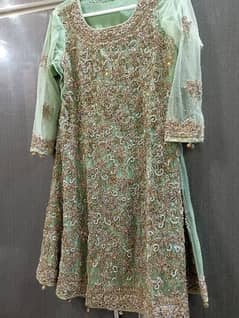 Bridal dress in pistachio colour(tail lehnga, heavy shirt and dupatta)